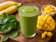 Fresh green smoothie with fruity ingredients