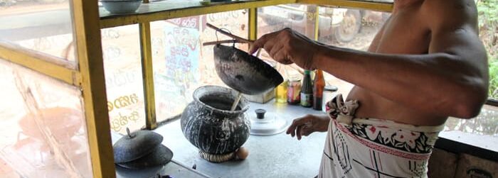 Streetvendor making egghoppers Streetvendor making egghoppers