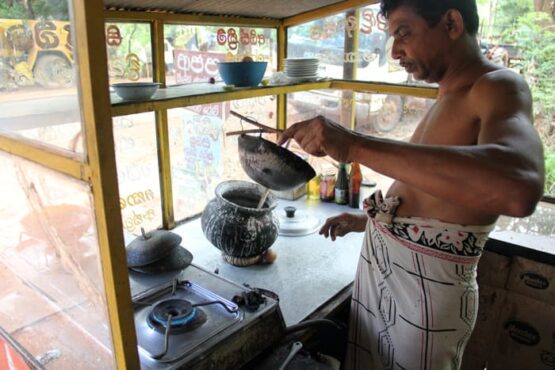 Streetvendor making egghoppers Streetvendor making egghoppers